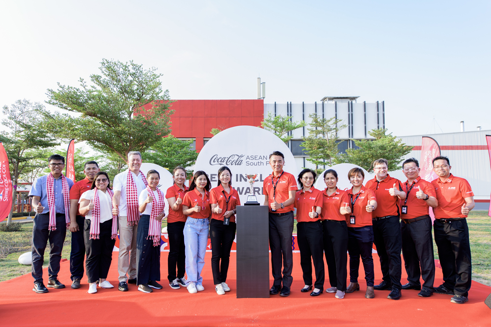 Our management team and representatives from The Coca-Cola Company attended the award presentation. 