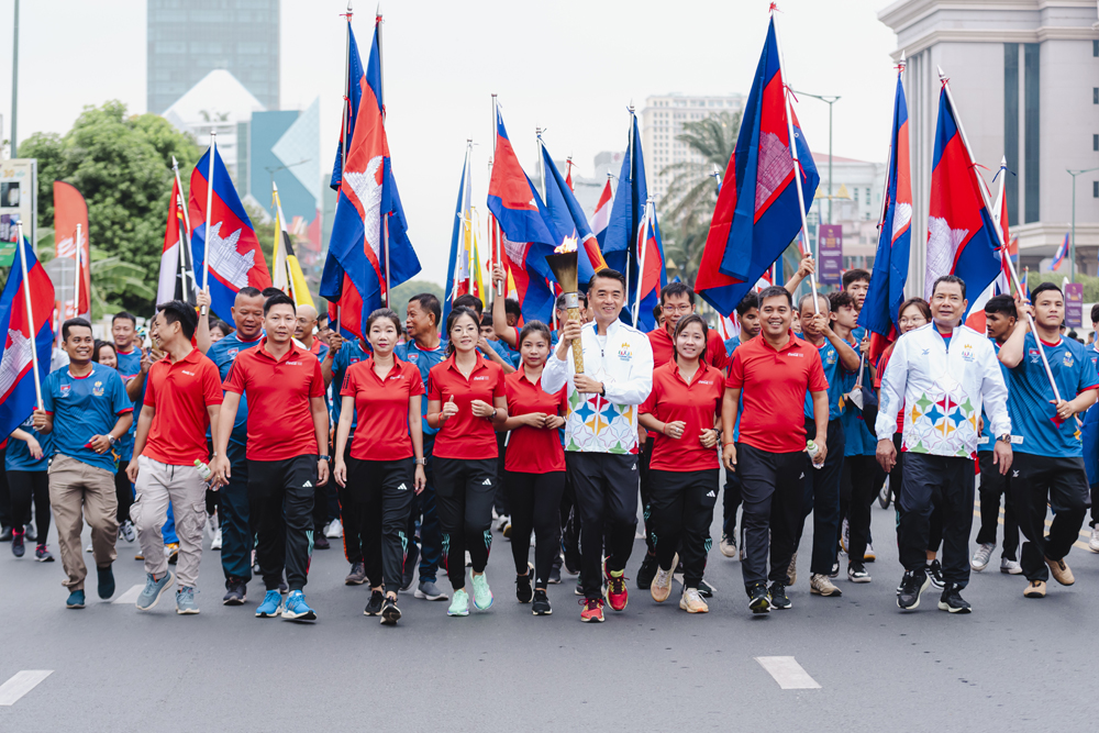 The torch was carried by Mr. Joseph Ho, CEO of Coca-Cola Cambodia.