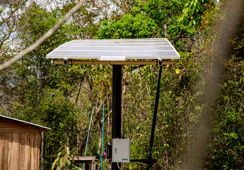 The solar panels convert sunlight into energy to power the irrigation system.